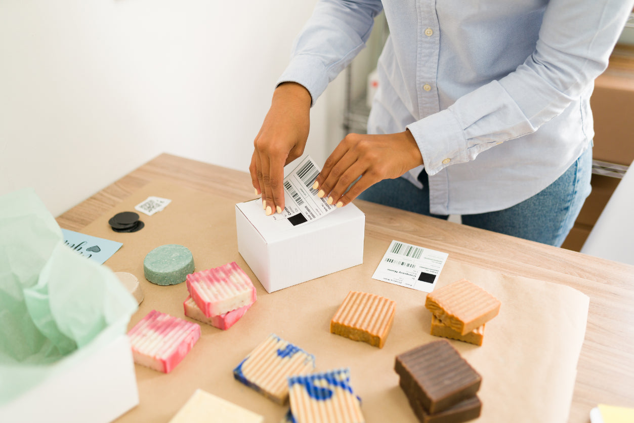 Person applying package label created with label printing service